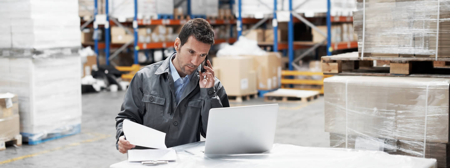 talking on the phone and holding documents