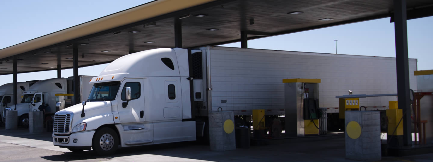 mindful of the fuel surcharge. An orange circle with a white fuel pump icon is overlaid on the left side of the image