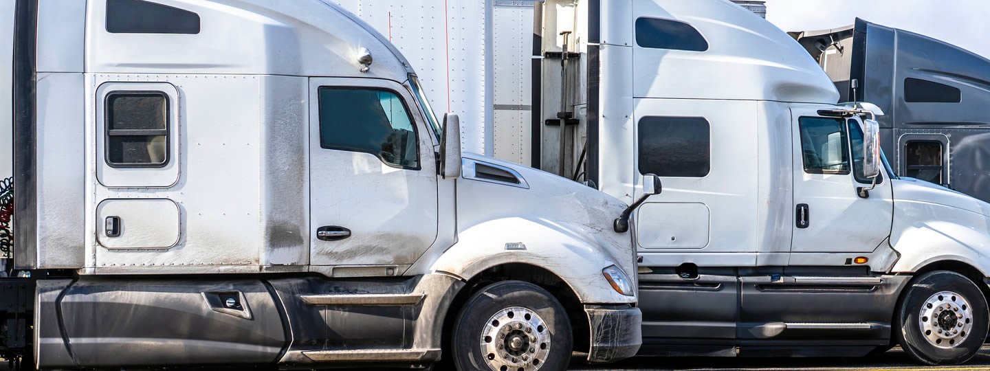 emphasizing their trailers and cabs. In front