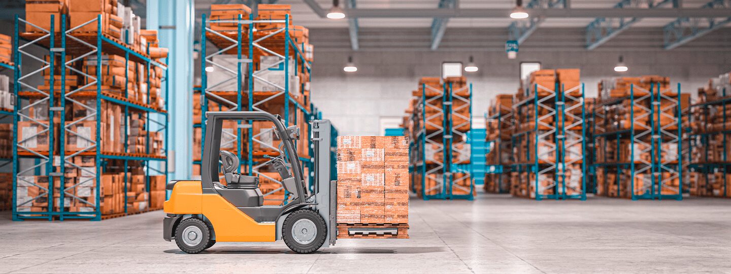 and the facility features high ceilings and a blend of natural and artificial lighting.|A forklift transports a wooden pallet in a spacious warehouse. Rows of filled blue and orange metal racks line both sides of the concrete floor