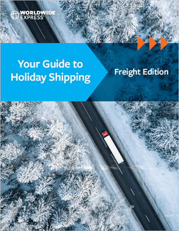 capturing the essence of holiday shipping in winters tranquil embrace.|Aerial view of a straight road cutting through a snow-covered forest. Amid the holiday shipping season