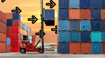 A forklift lifts a blue shipping container among stacks of multicolored containers in a storage yard. Black arrows point to the container being lifted. The sky is a warm orange
