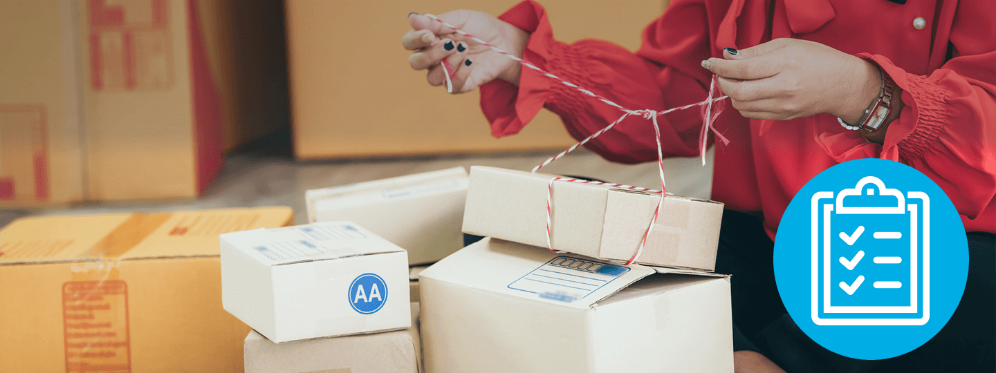 tying red and white string. Some boxes are open