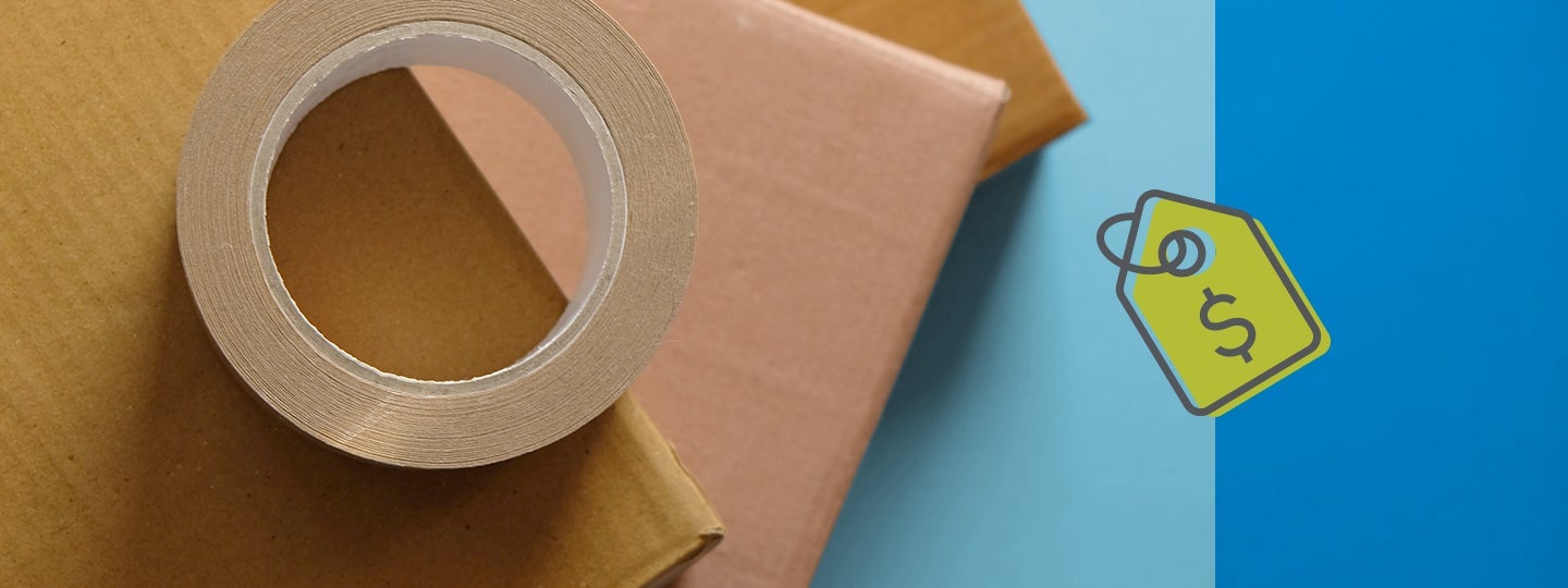 underscoring low shipping costs.|A roll of brown packing tape sits atop a stack of cardboard boxes against a blue backdrop. On the right