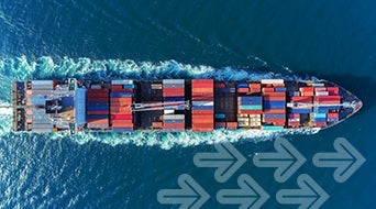 Aerial view of a large cargo ship carrying multicolored shipping containers moving through the ocean. The water is deep blue with a visible wake. Several translucent arrows are overlaid