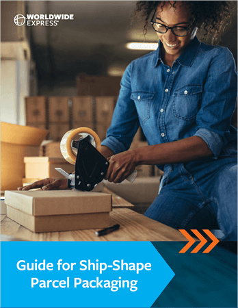 with two white boxes and a bubble-wrapped item inside against a blue background adorned with a zigzag arrow pattern.|A person in a denim shirt expertly uses a tape dispenser to seal a cardboard box