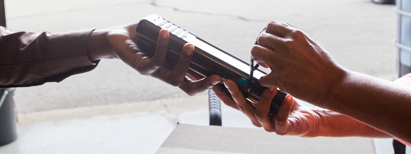 emphasizing their hands and the device.|Infographic about Worldwide Express package delivery. Includes details on when UPS Signature Required is needed