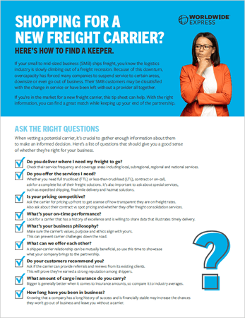 a man in a white shirt discusses freight carrier relationships on his smartphone. Nearby