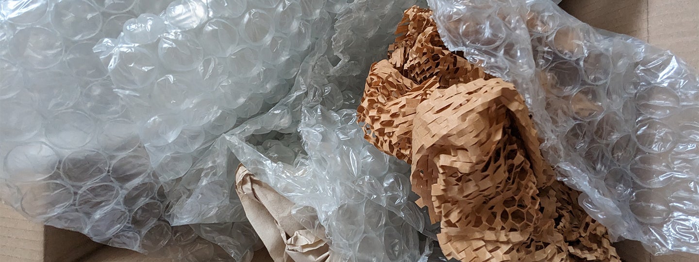 directing attention to the packaging materials.|A box filled with premium packing materials