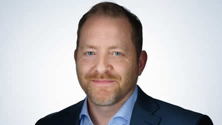 A man with short hair and a beard