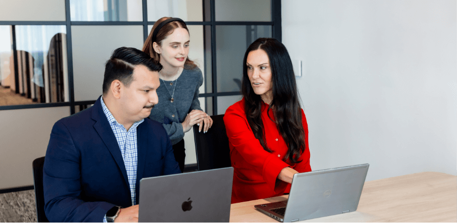 Two people looking at their computers